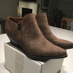 Brown slip on Western inspired bootie.